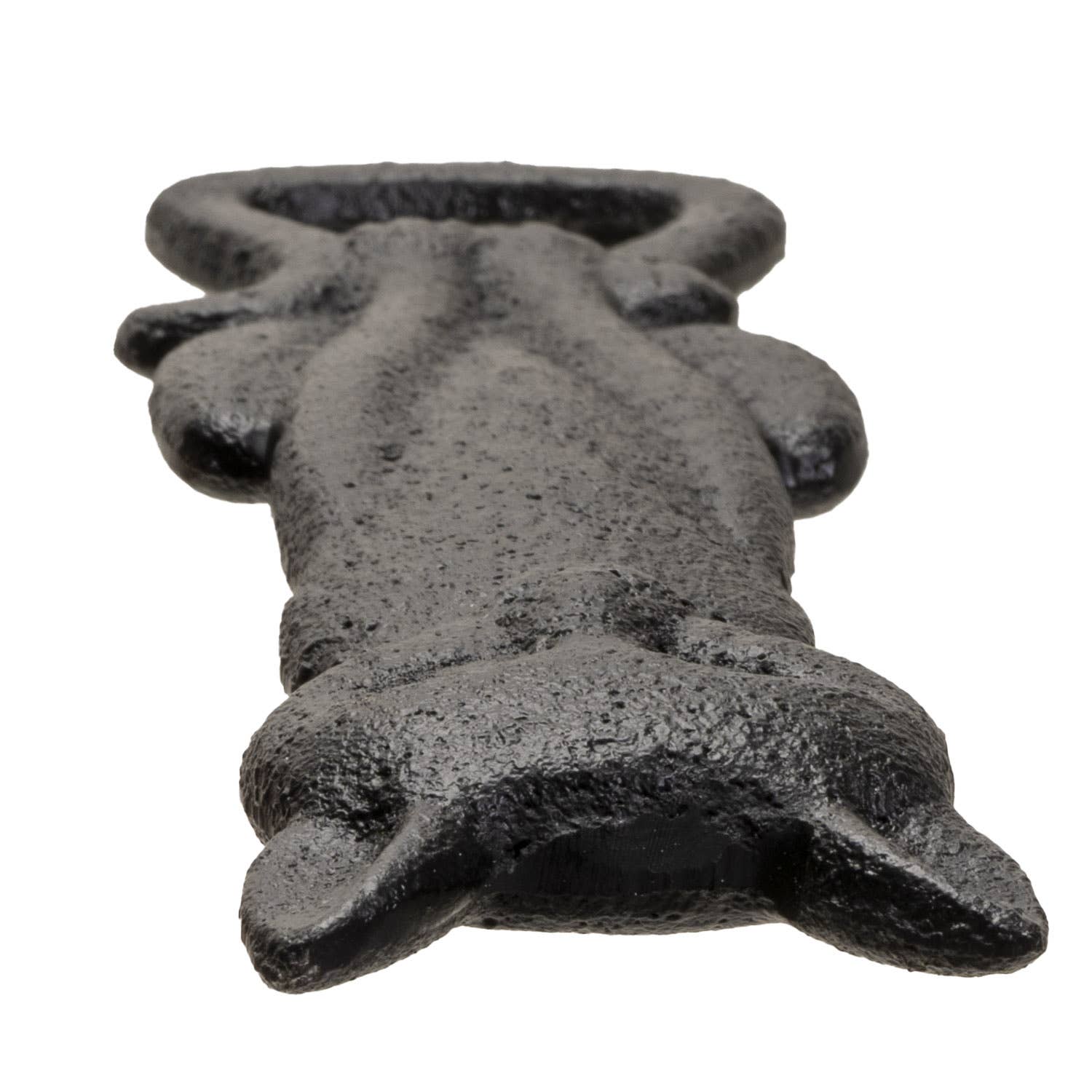 Black cast iron black cat bottle opener from side angle, on a white background