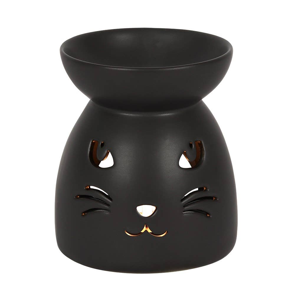 A black ceramic oil burner with a design resembling a cat's face.