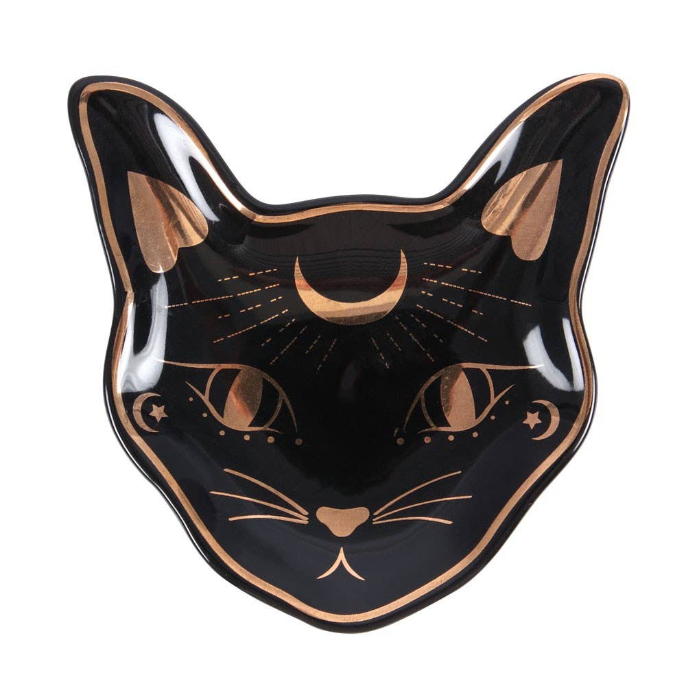 A black ceramic trinket dish with gold accents in the shape of a cat's head.