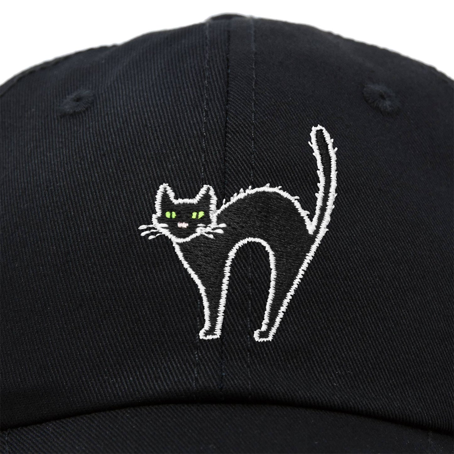 Black baseball cap with a white embroidered design of a cat with arched back and green eyes.