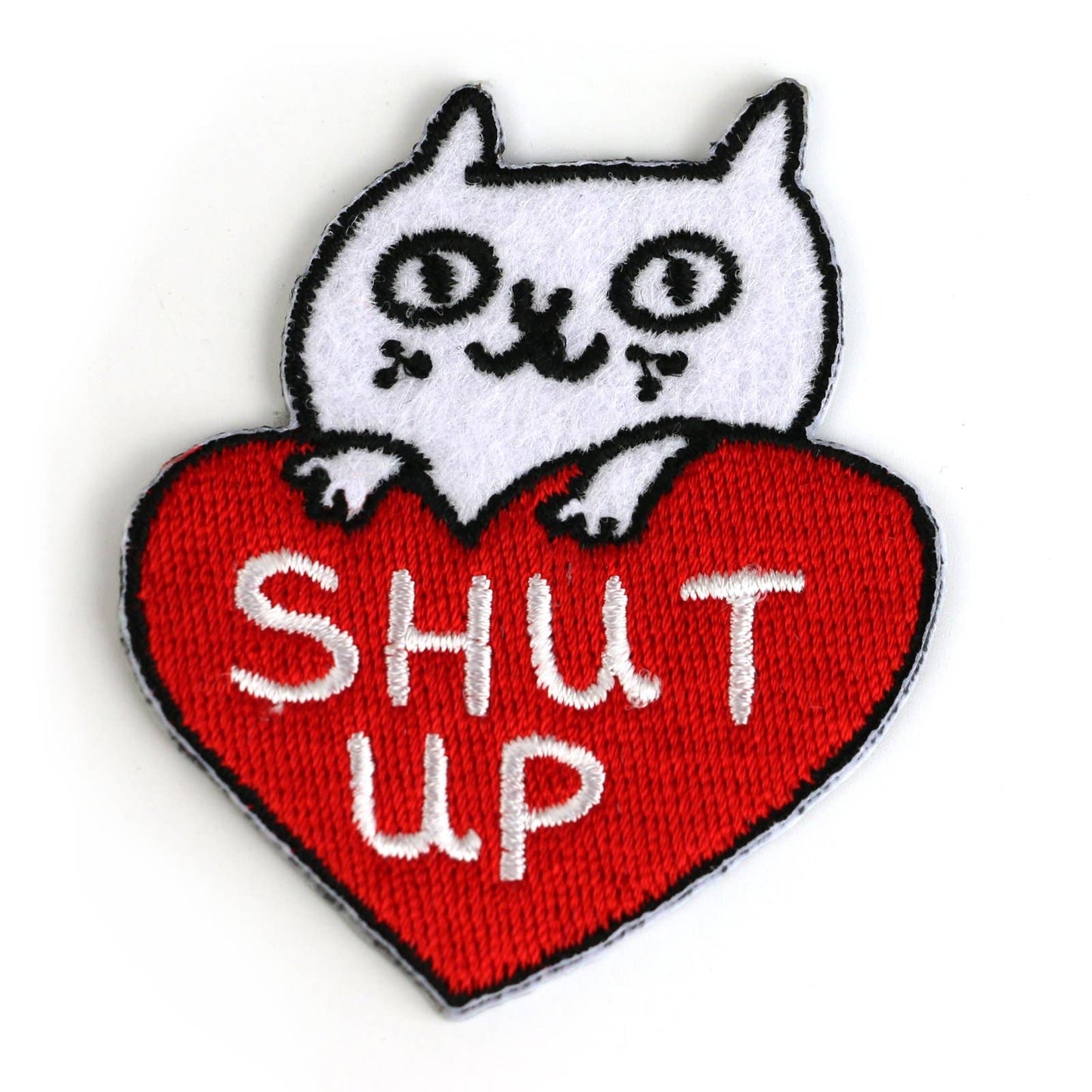 Patch with a white cat on a red heart-shaped patch with 'SHUT UP' text