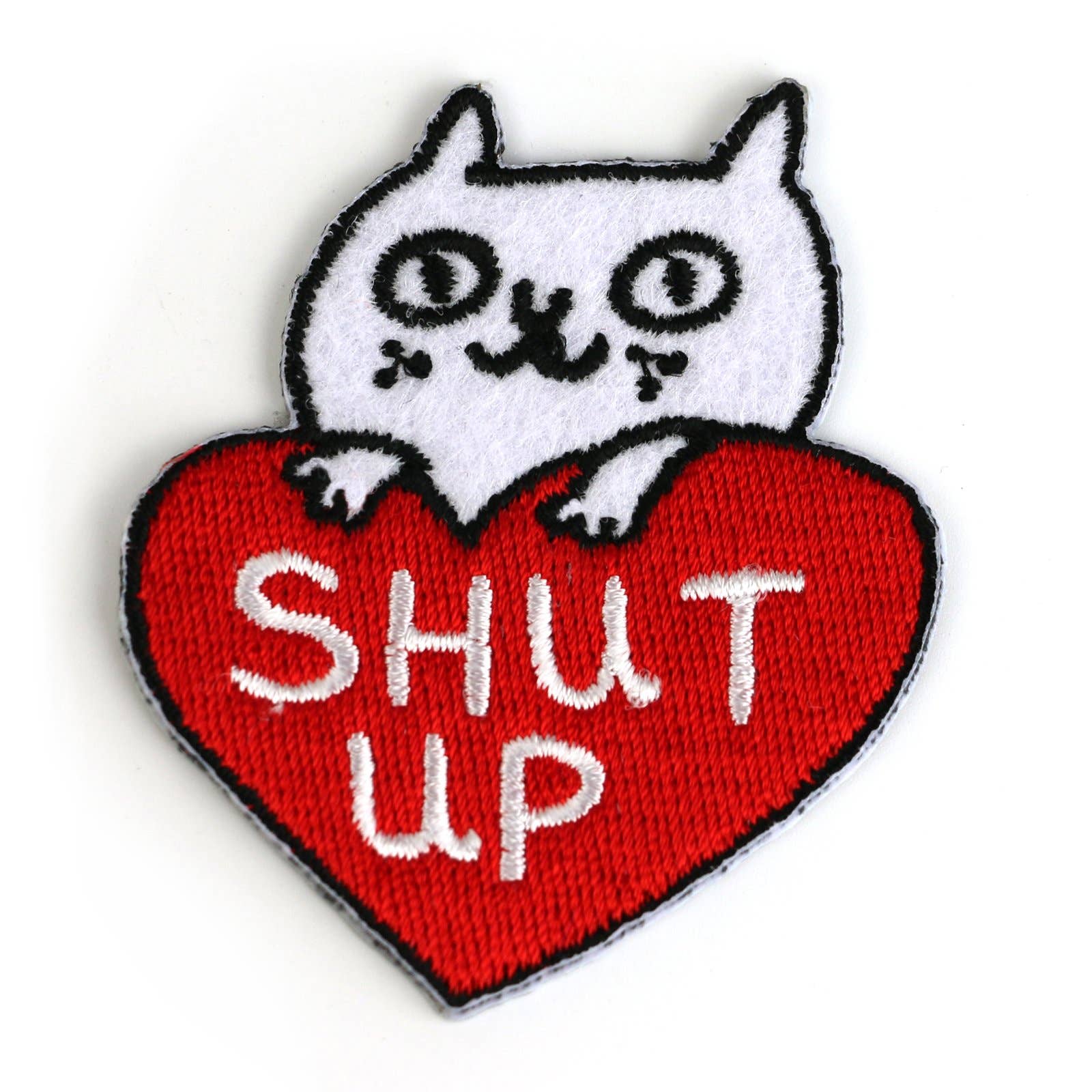 Patch with a white cat on a red heart-shaped patch with 'SHUT UP' text