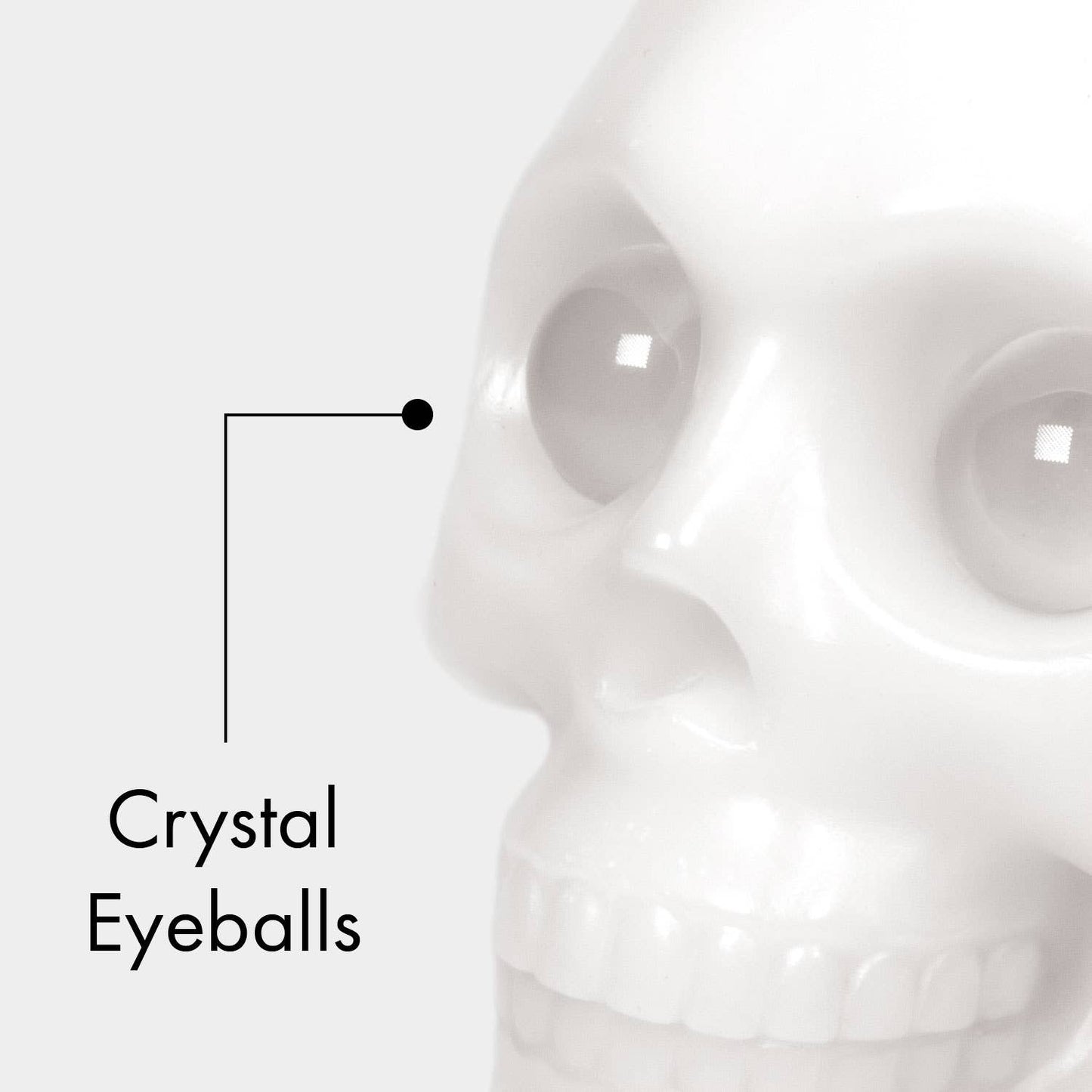Close-up of a skull with crystal-like eyeballs on a white background