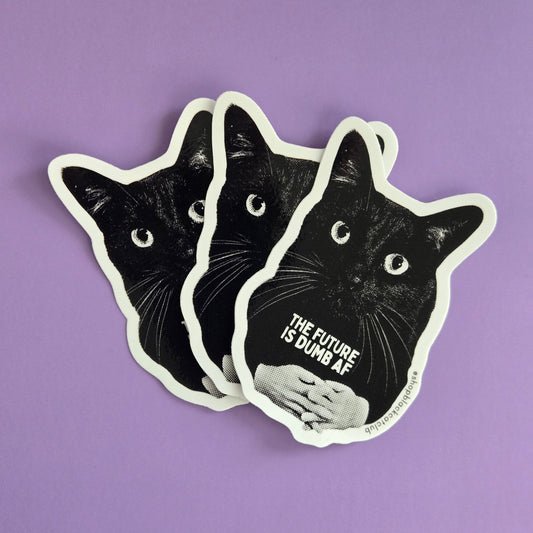 Black cat-shaped sticker with text 'THE FUTURE IS DUMB AF" on a purple background